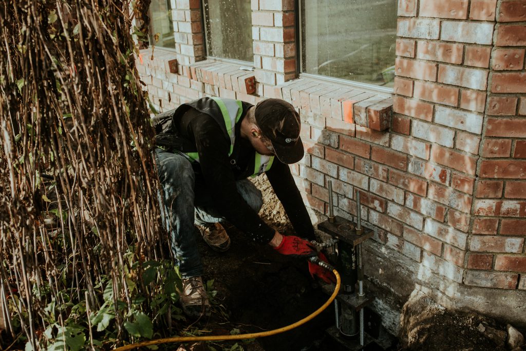 Staff fixing foundation candid helical pier