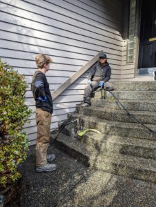 crew repairing concrete steps