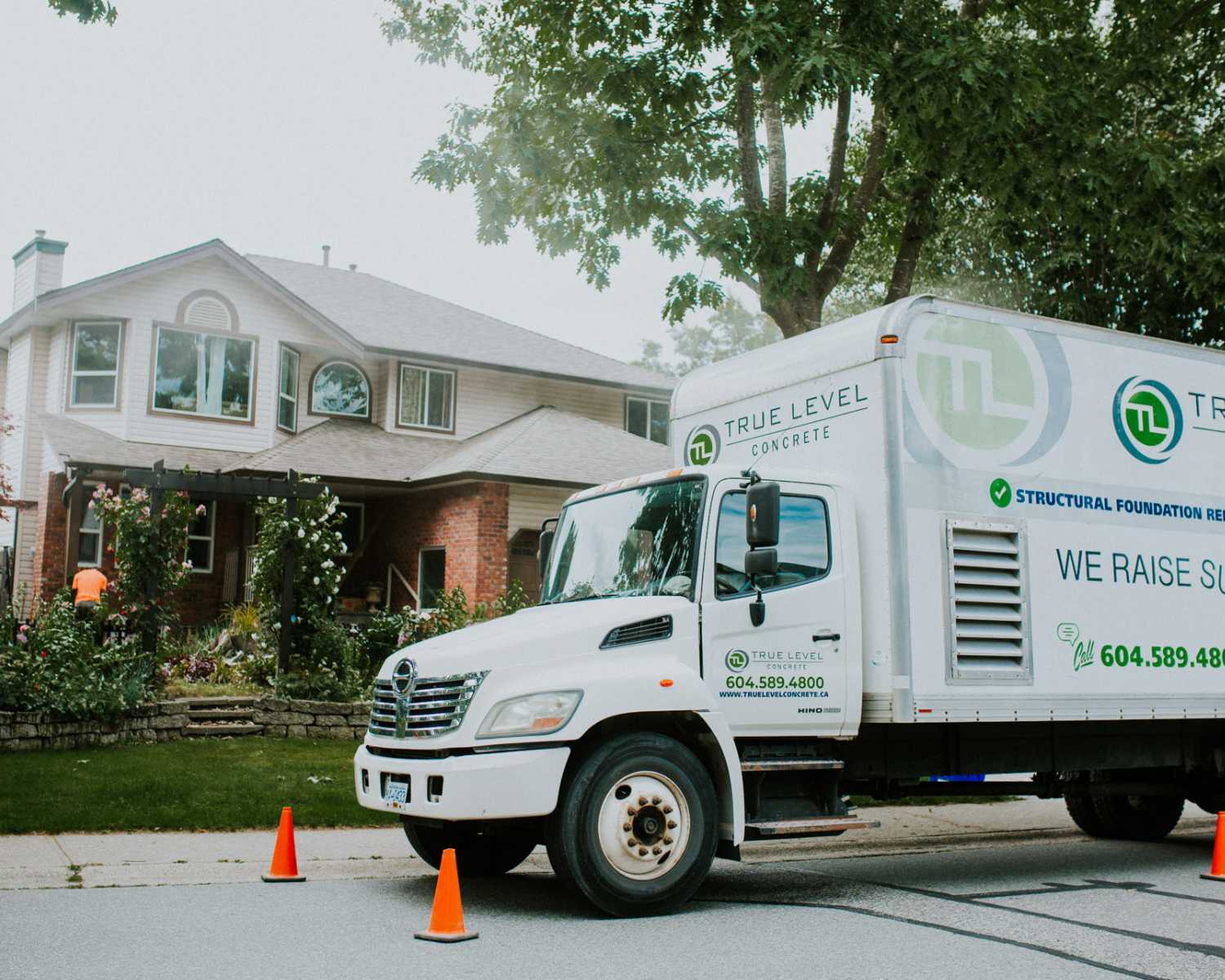 who we help truck in front of house