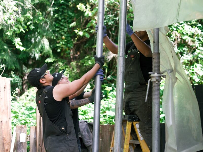 crew members installing a pier support beam