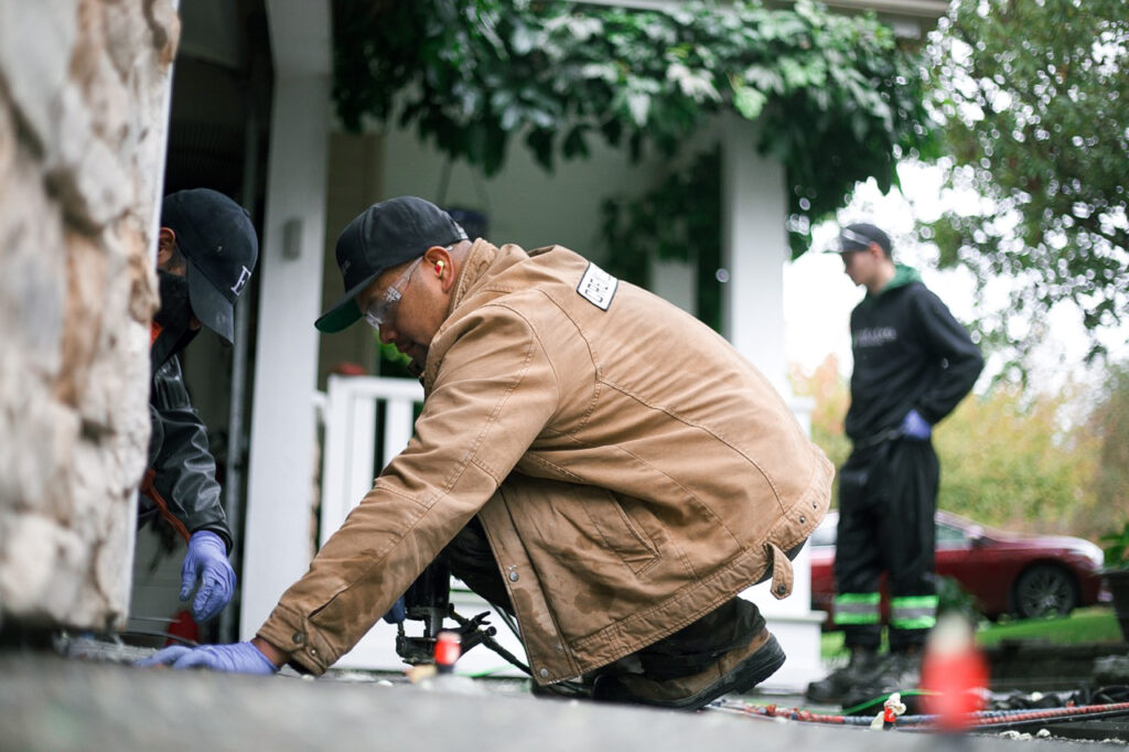 installer doing a driveway and garage floor level