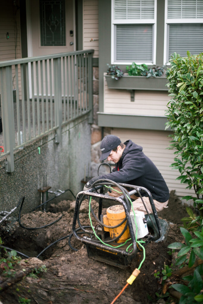 installation of push piers lifting a concrete front porch repair