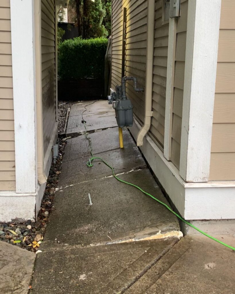 Concrete repair before crooked walkway